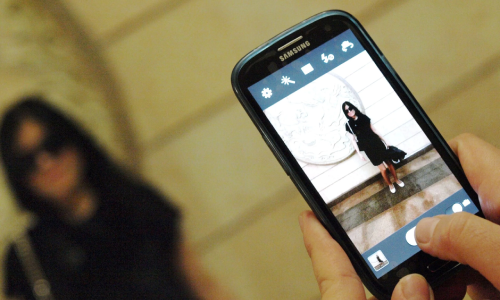 taking a picture of a woman