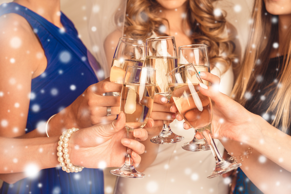 women with glasses of champagne, winter theme