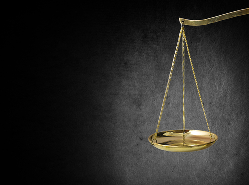justice scales on a black background