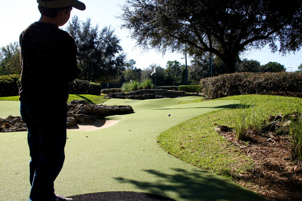 kid playing golf