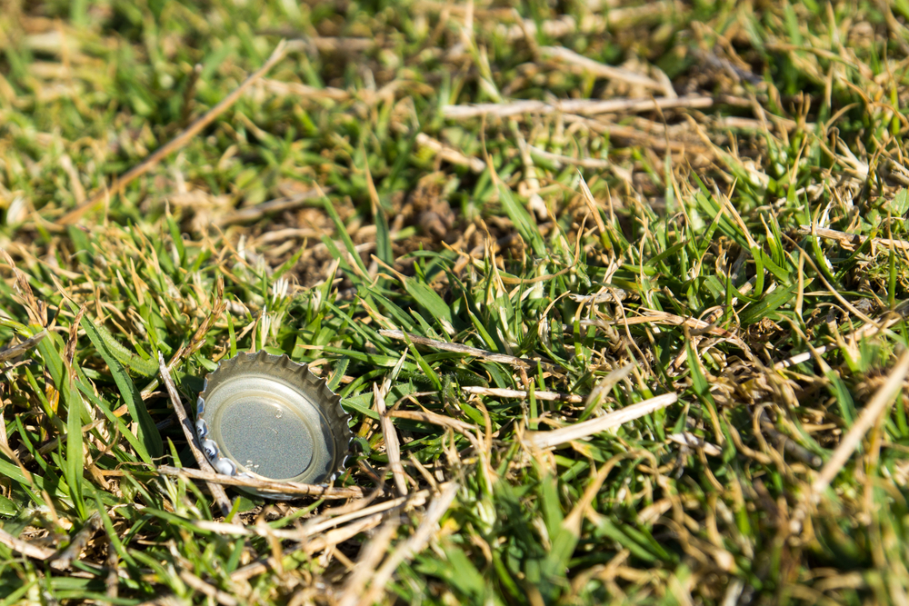 bottlecap on green grass background